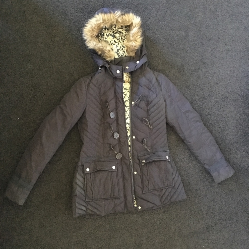 Free People parka with faux fur trimmed hood.